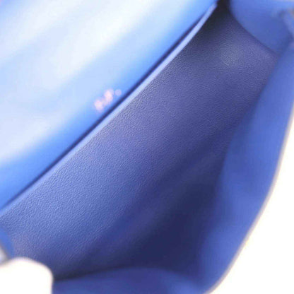 Close-up of electric blue leather interior and stitched edge of the pochette