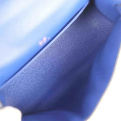 Close-up of electric blue leather interior and stitched edge of the pochette