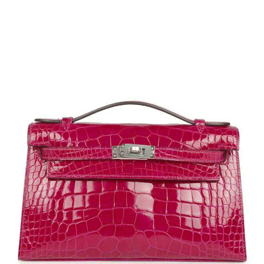 Crocodile-effect Kelly-style handbag with top handle, magenta, palladium-tone clasp