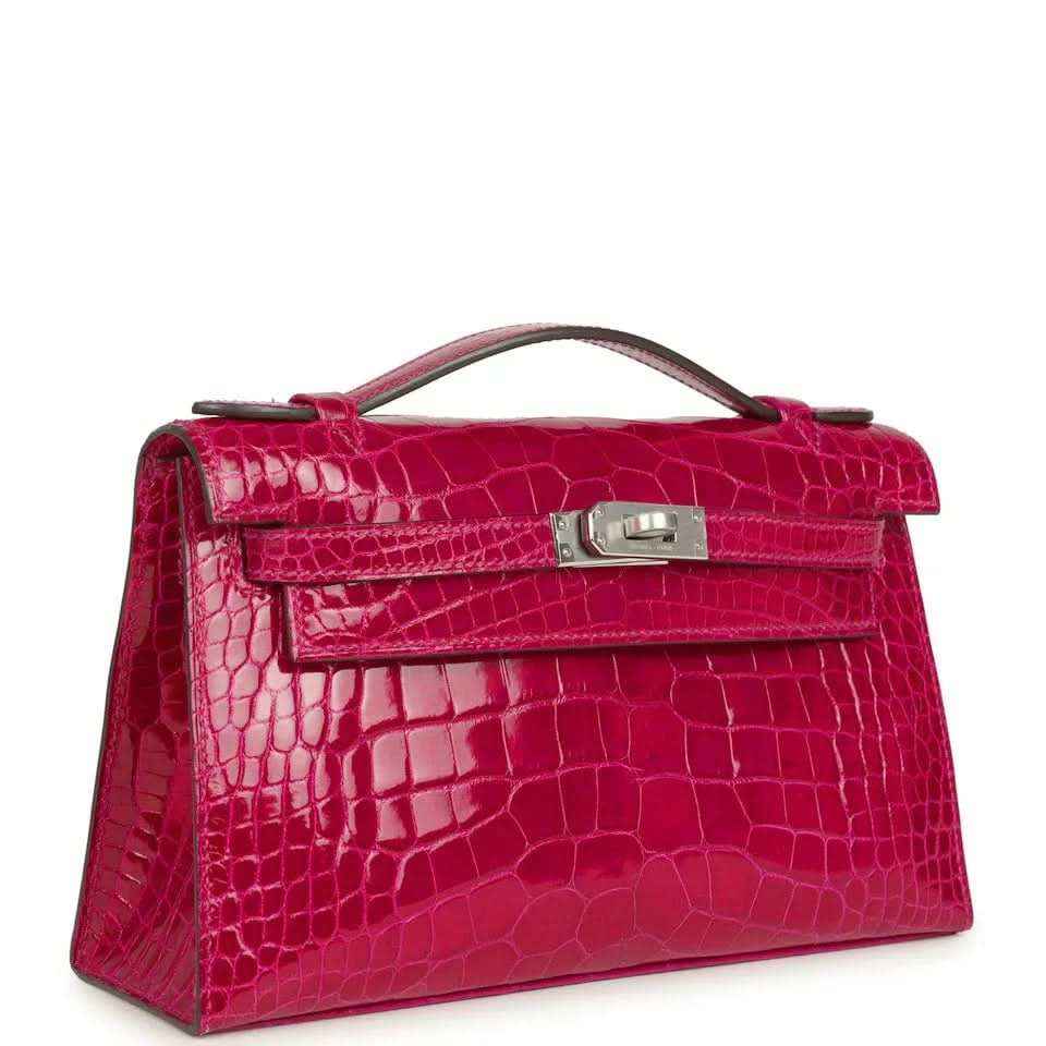 Crocodile-effect Kelly-style handbag with front flap, magenta leather, metal turn-lock