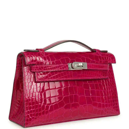 Crocodile-effect Kelly-style handbag with front flap, magenta leather, metal turn-lock