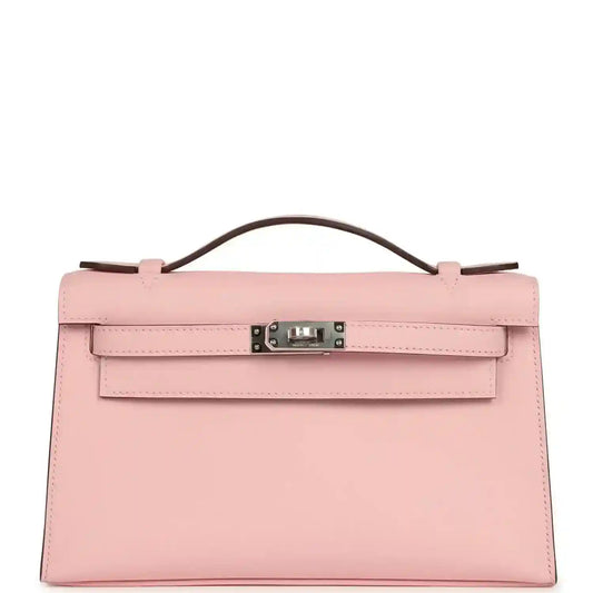Hermes Kelly pochette bag in rose pink leather with handle, flap and palladium clasp