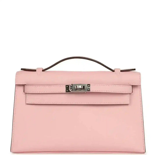 Hermes Kelly pochette bag in rose pink leather with handle, flap and palladium clasp