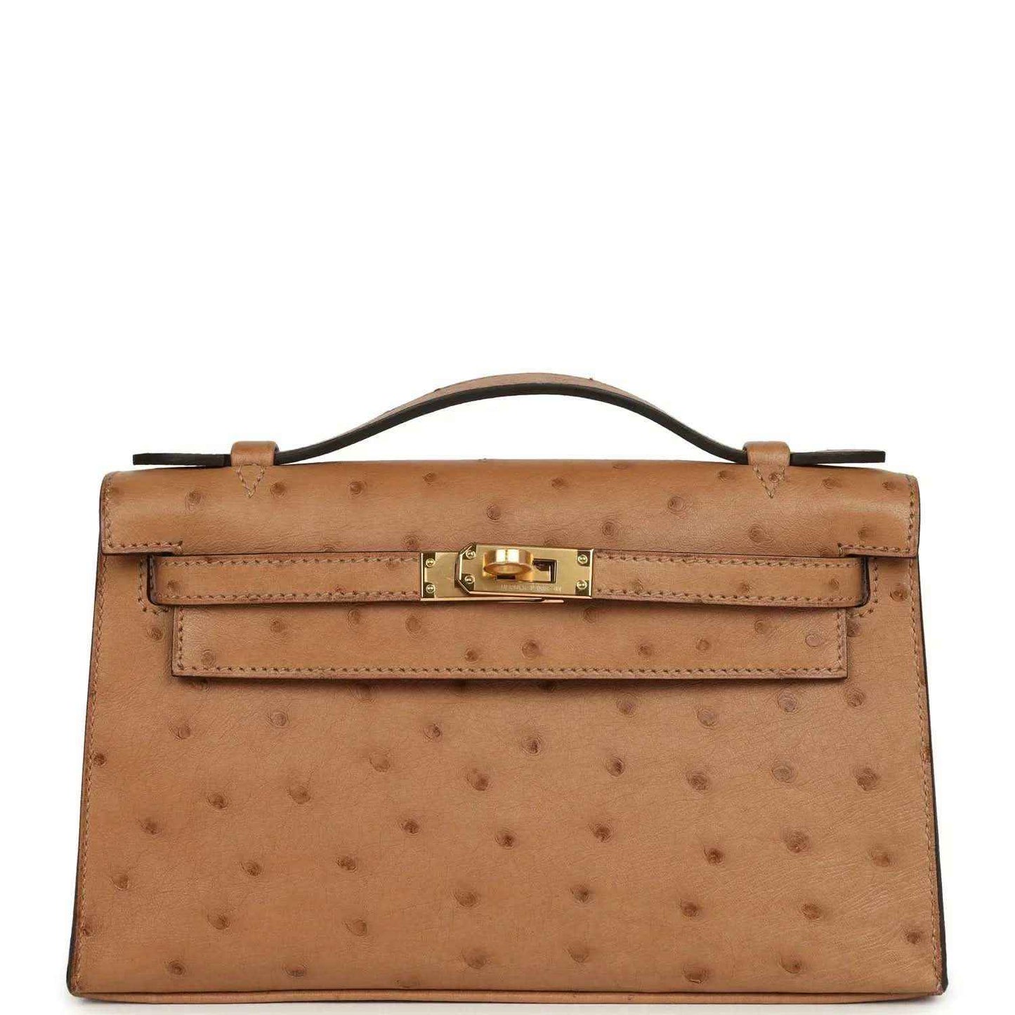 Tan textured leather clutch with gold front turn-lock and structured flap