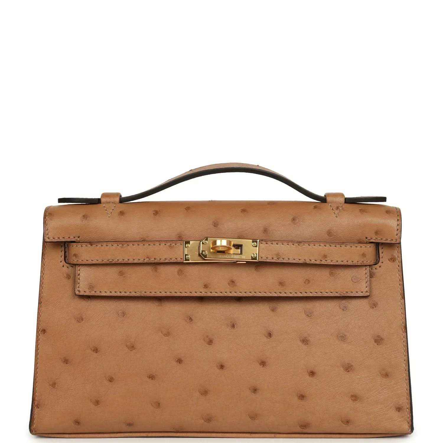 Tan textured leather clutch with gold front turn-lock and structured flap