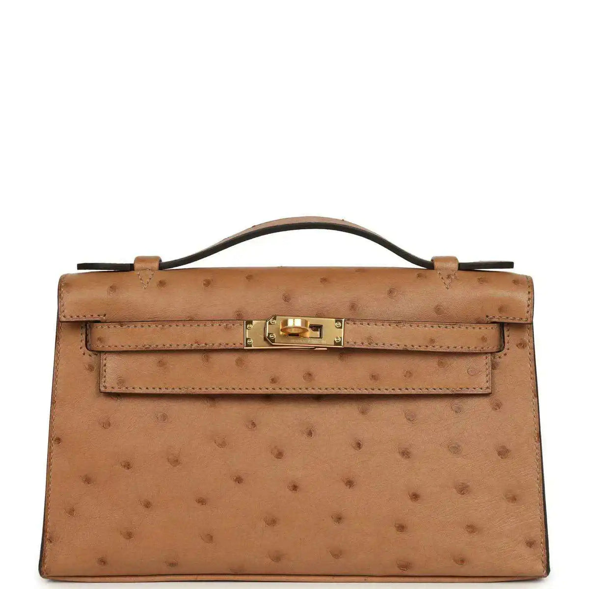 Tan textured leather clutch with gold front turn-lock and structured flap
