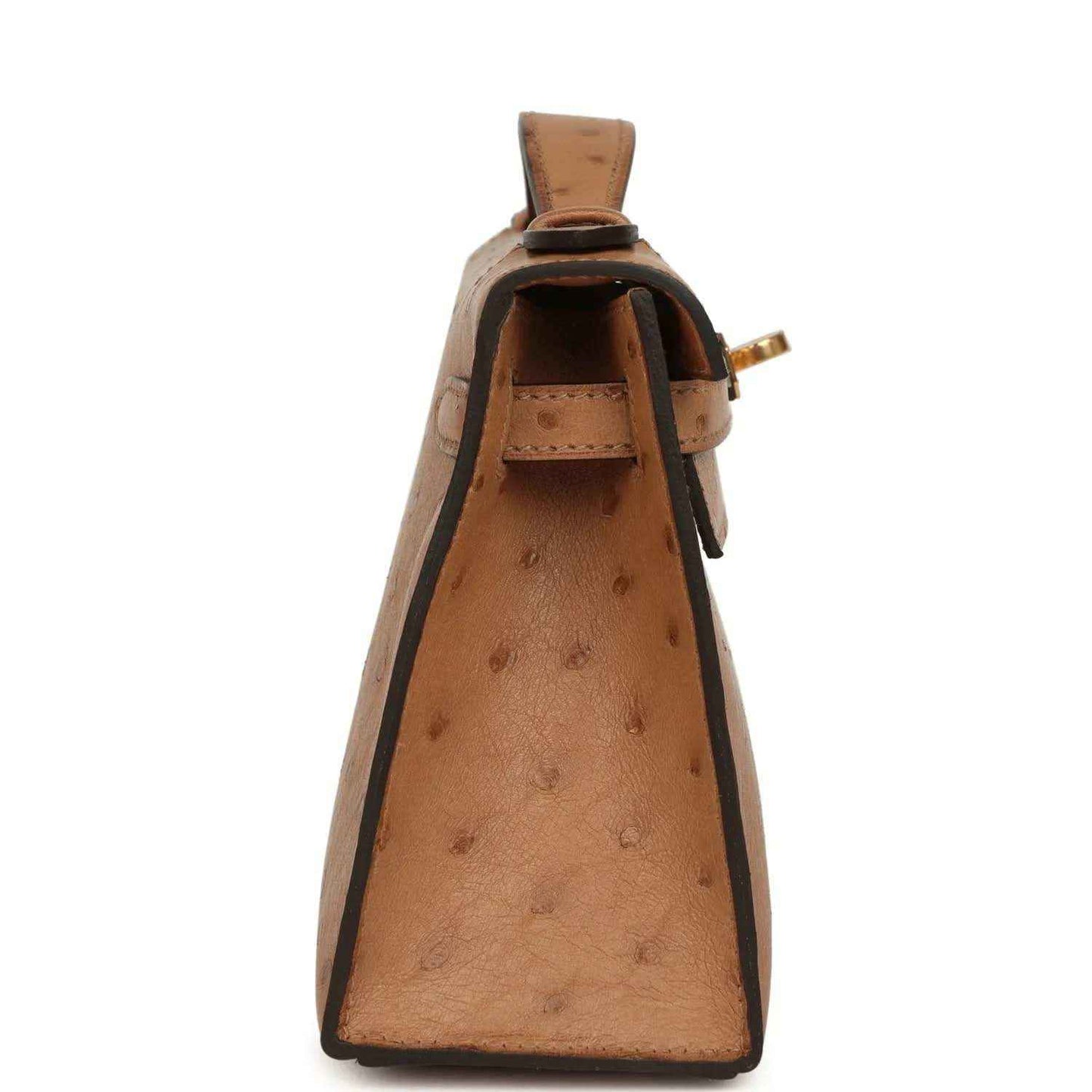 Tan textured leather clutch with top handle and open side profile