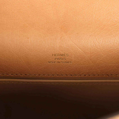 Embossed “HERMES PARIS” brand text on tan leather lining