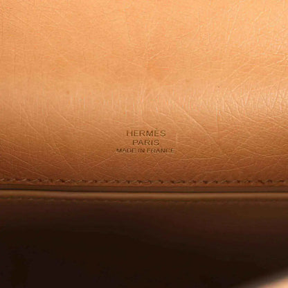Embossed “HERMES PARIS” brand text on tan leather lining