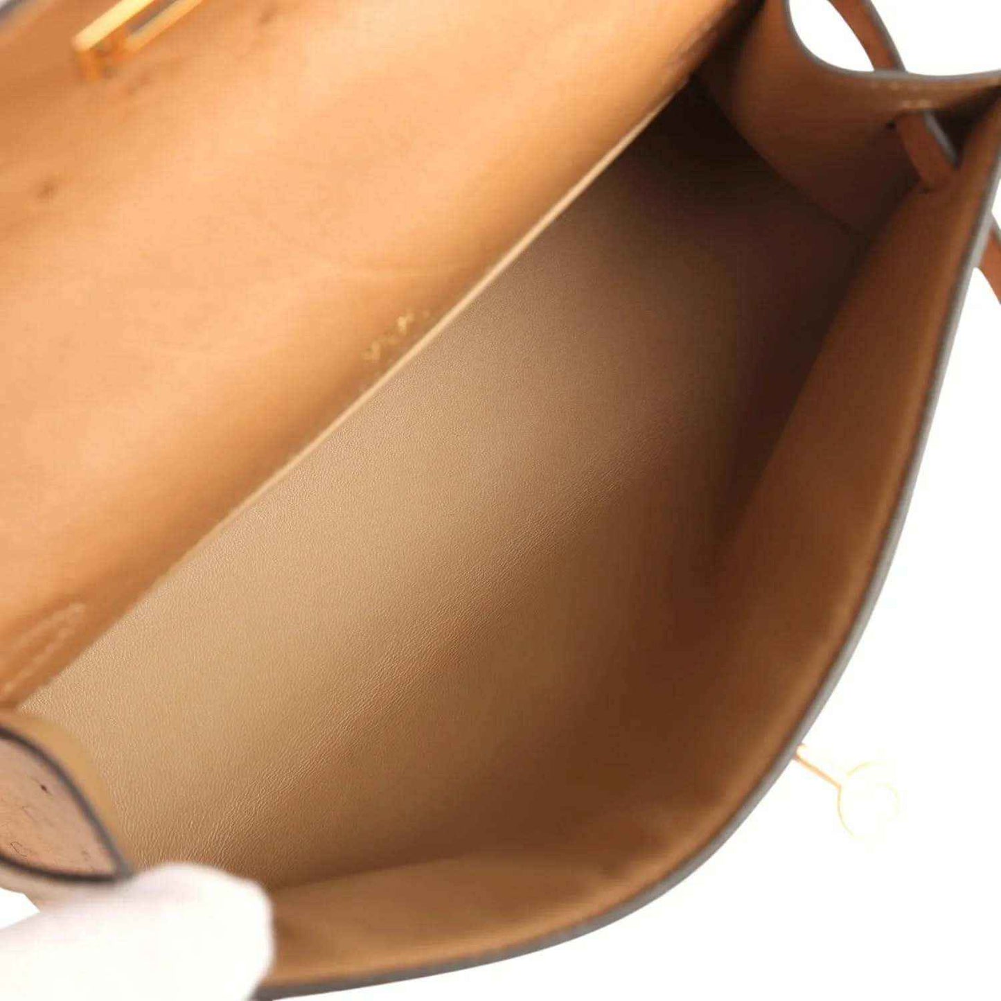 Tan leather interior lining with side walls and stitched seam