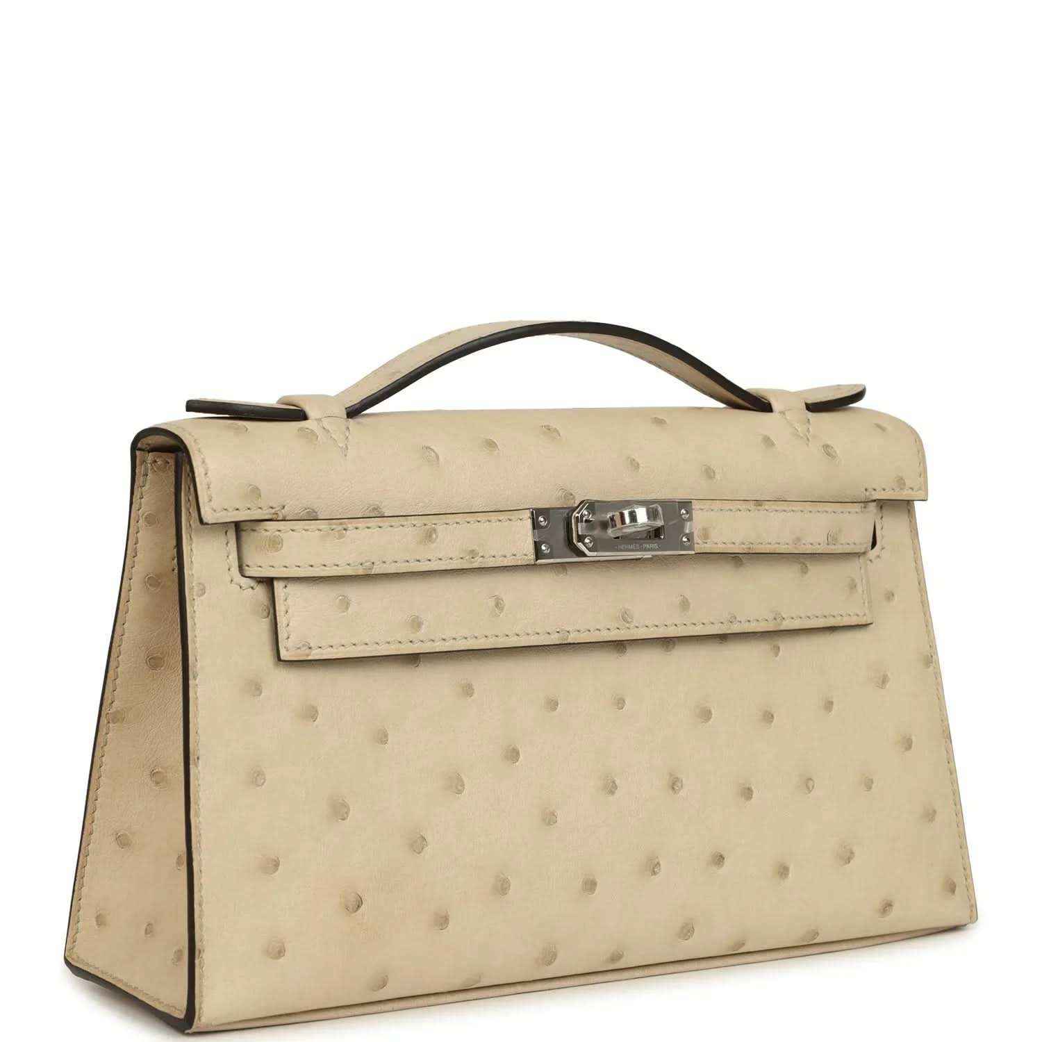 Beige ostrich-leather clutch with curved handle and front flap, side profile