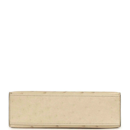 Beige ostrich-leather clutch with long slim shape and stitched border