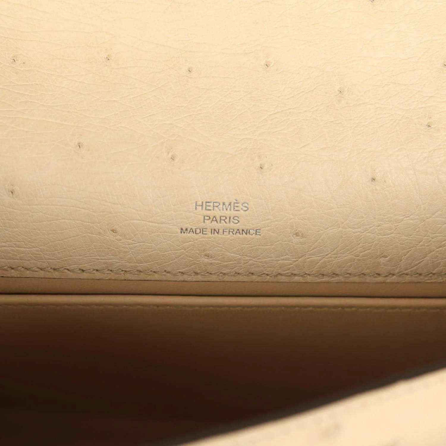Hermes leather stamp on beige clutch lining: Hermes Paris Made in France