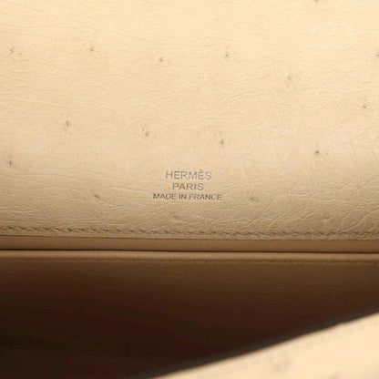 Hermes leather stamp on beige clutch lining: Hermes Paris Made in France