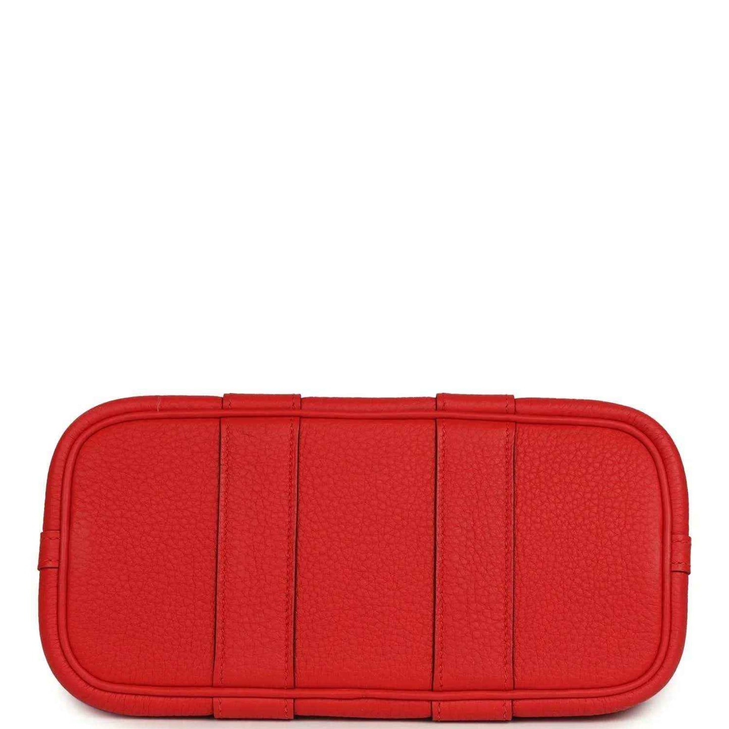 Red structured leather tote bag with flat base and segmented front panels