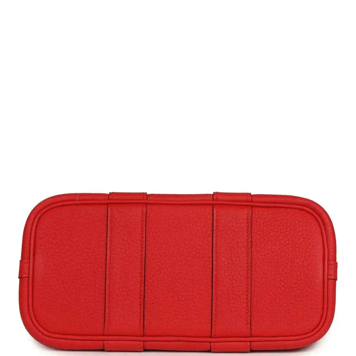 Red structured leather tote bag with flat base and segmented front panels