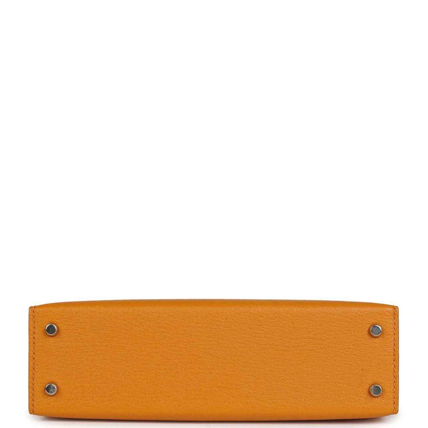 Mustard yellow leather handbag base with two metal corner studs and smooth panel