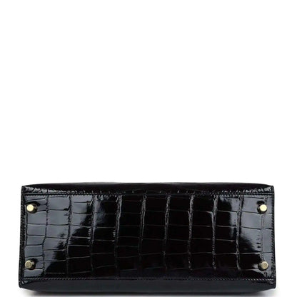 Black alligator leather Kelly handbag lining with gold rivets and studs