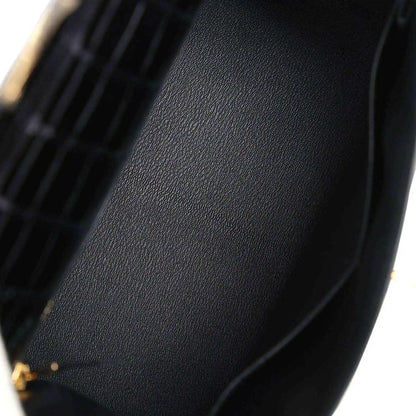 Black leather lining panel with stitched edge and gold-tone hardware