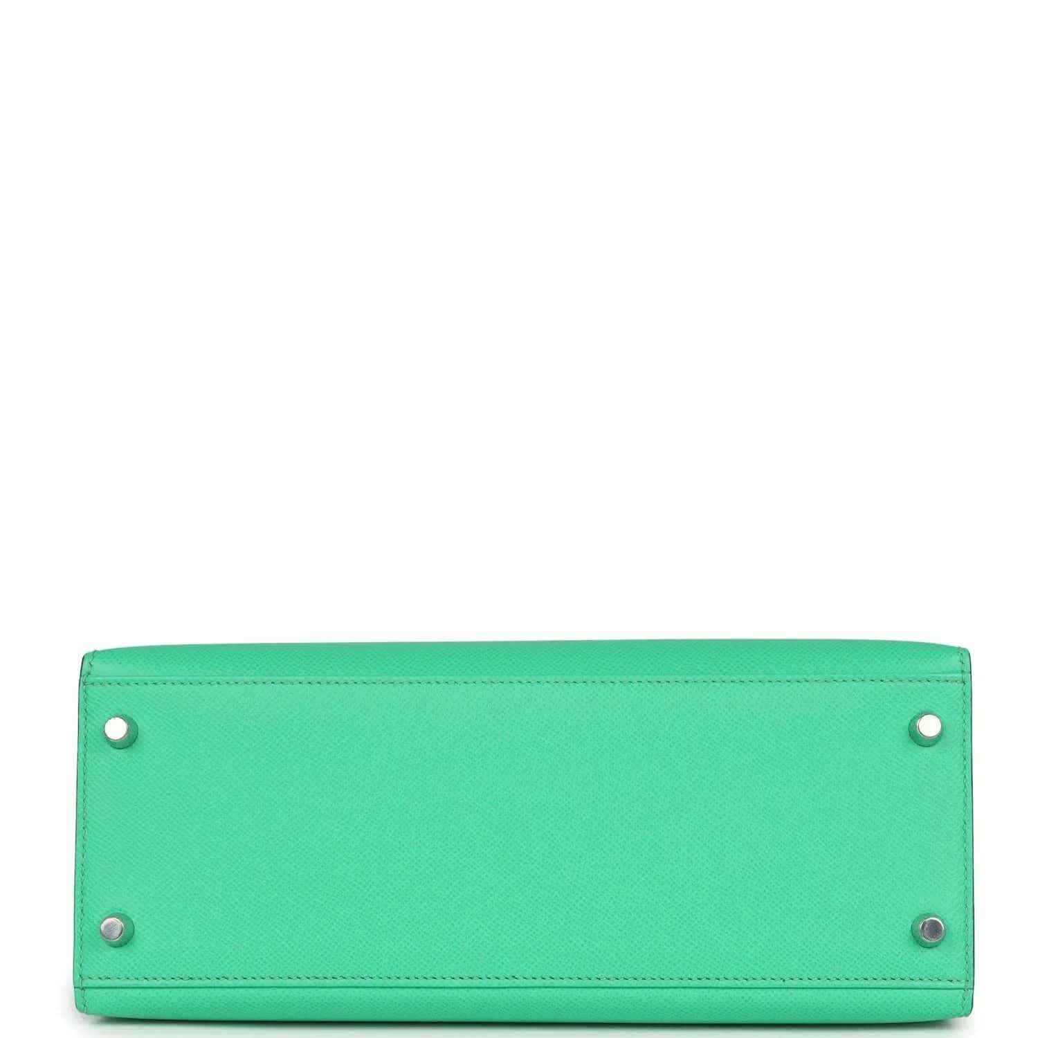 Green leather rectangular bag base with four corner rivets and side eyelets