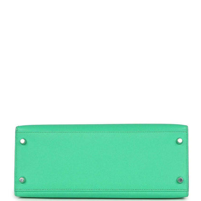 Green leather rectangular bag base with four corner rivets and side eyelets