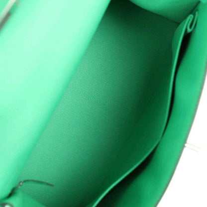 Green leather interior lining of a top-handle handbag