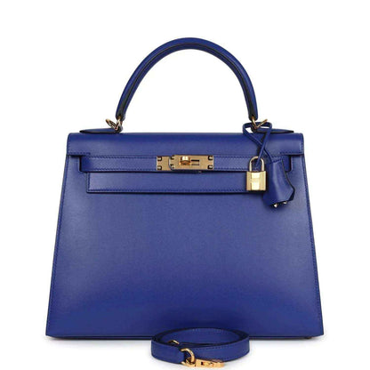 Blue leather Kelly-style handbag with top handle, front flap, and gold clasp