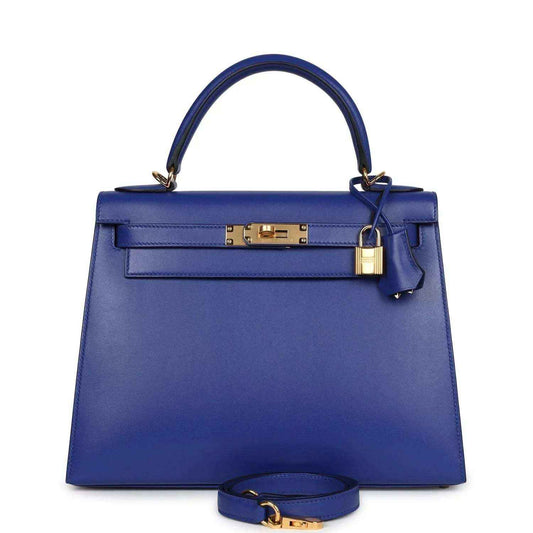 Blue leather Kelly-style handbag with top handle, front flap, and gold clasp