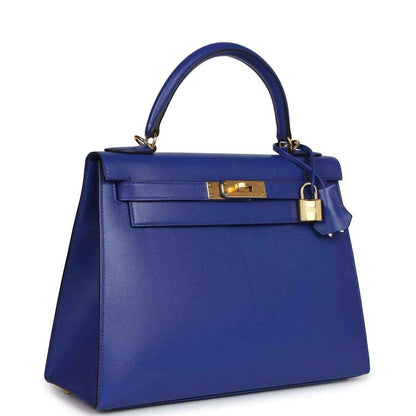 Blue leather Kelly-style handbag with gold front clasp and top handle