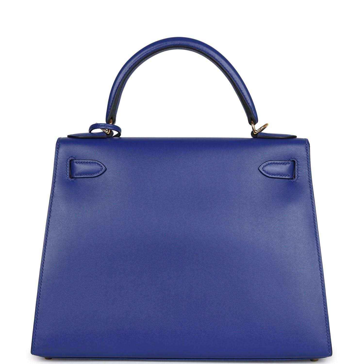 Blue leather Kelly-style handbag with top handle and embossed corner details