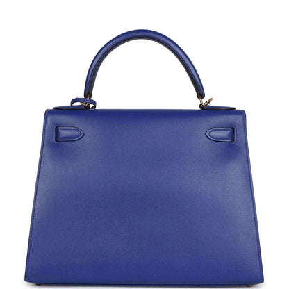 Blue leather Kelly-style handbag with top handle and embossed corner details