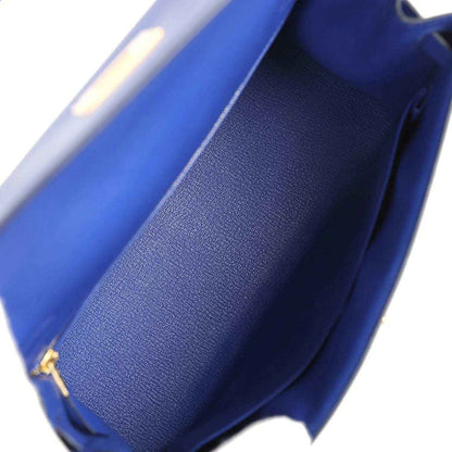 Blue leather handbag interior with textured lining and curved opening