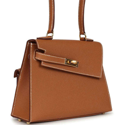 Hermes Kelly handbag tan leather with front flap and gold-tone clasp, side view