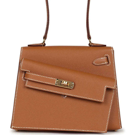 Hermes Kelly handbag in tan textured leather with gold-tone turn-lock on front flap