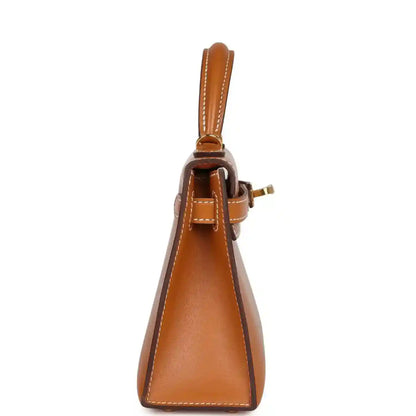 Kelly Sellier 20 handbag side view with top handle and gold hardware attachment