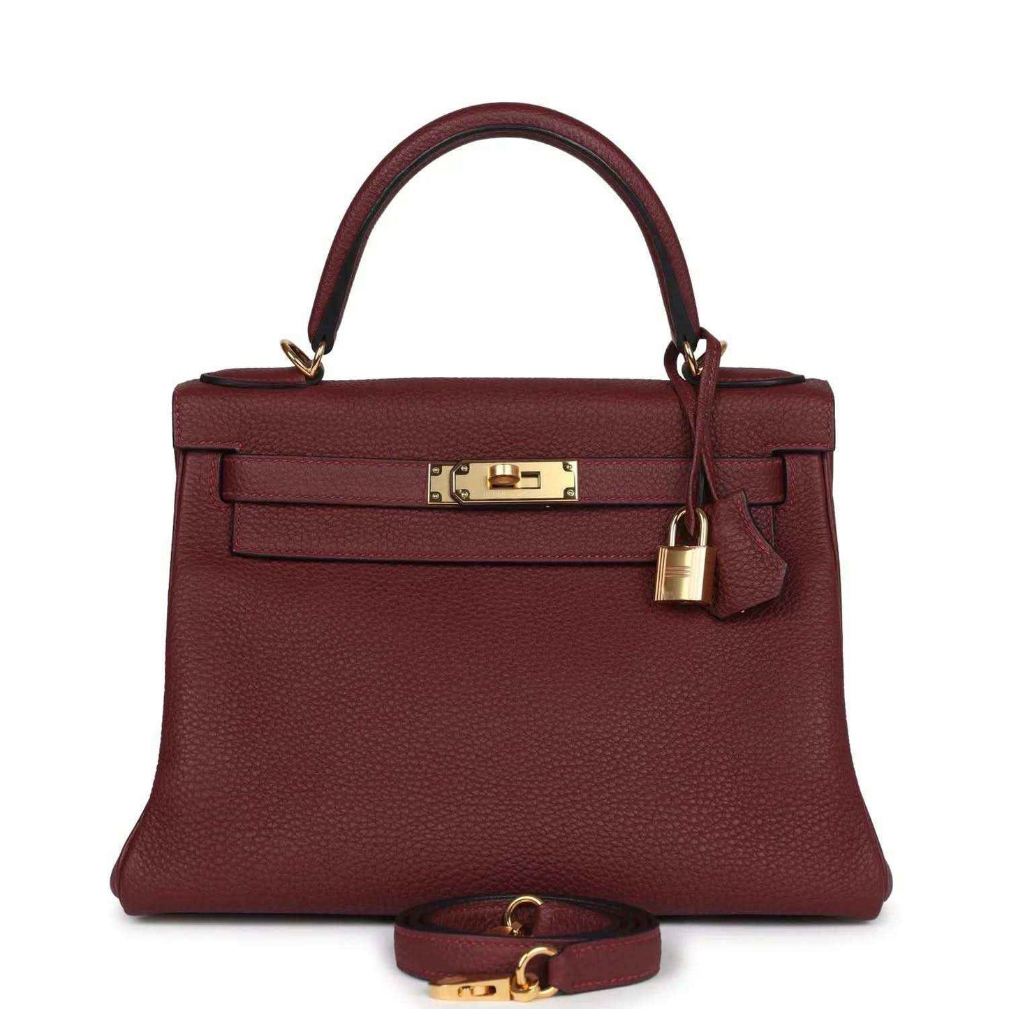 Red leather Hermès Kelly Retourne handbag with gold-tone front lock and top handles