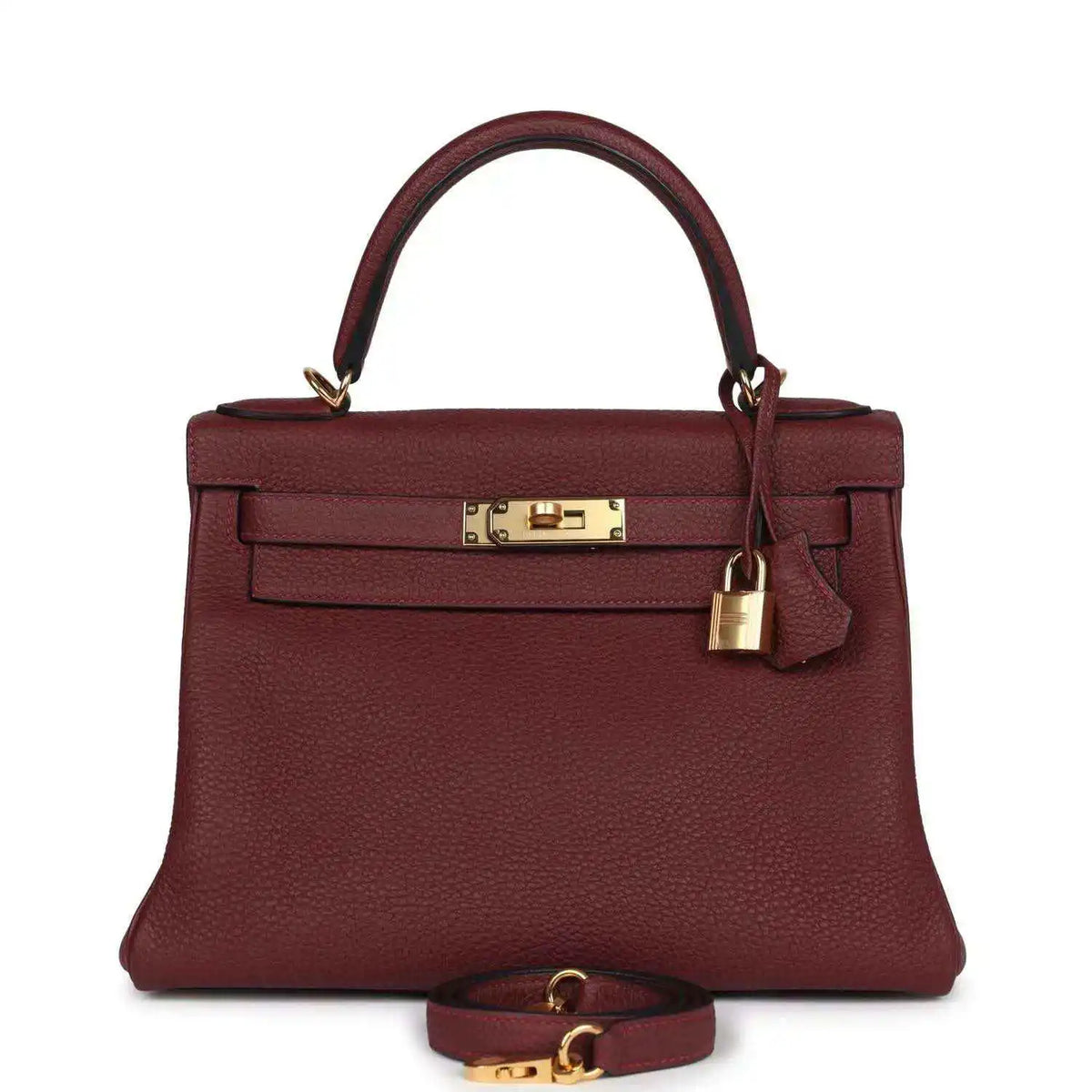 Red leather Hermès Kelly Retourne handbag with gold-tone front lock and top handles