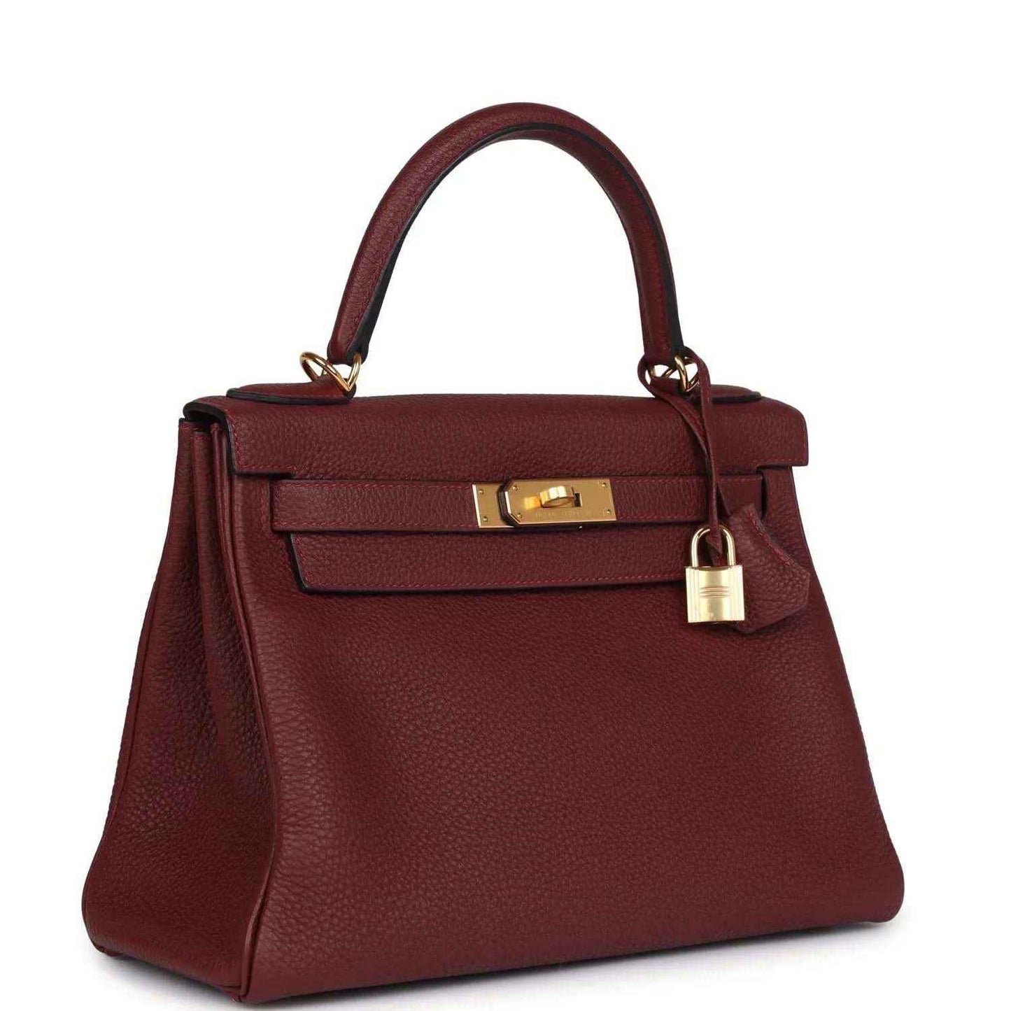 Red leather Hermès Kelly Retourne handbag with gold-tone lock and short handles