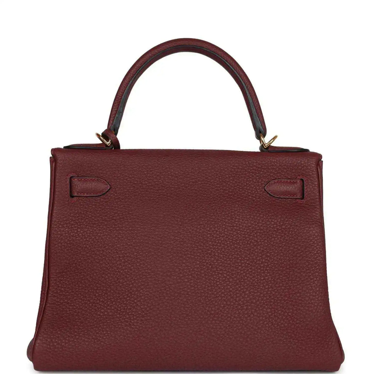 Red leather Hermès Kelly Retourne handbag back view with strap closures