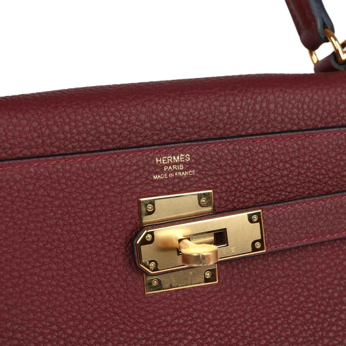 Hermès Kelly Retourne handbag clasp with engraved brand and gold-tone hardware