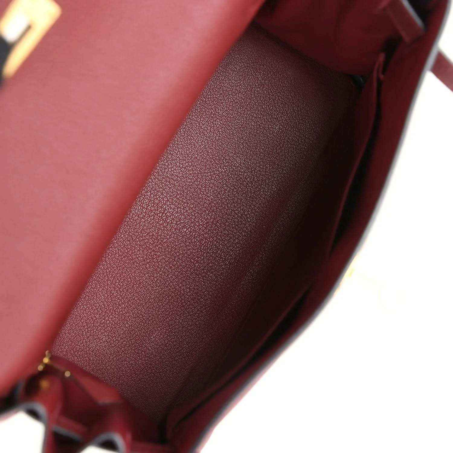 Red leather Hermès Kelly Retourne handbag interior with smooth lining and stitching