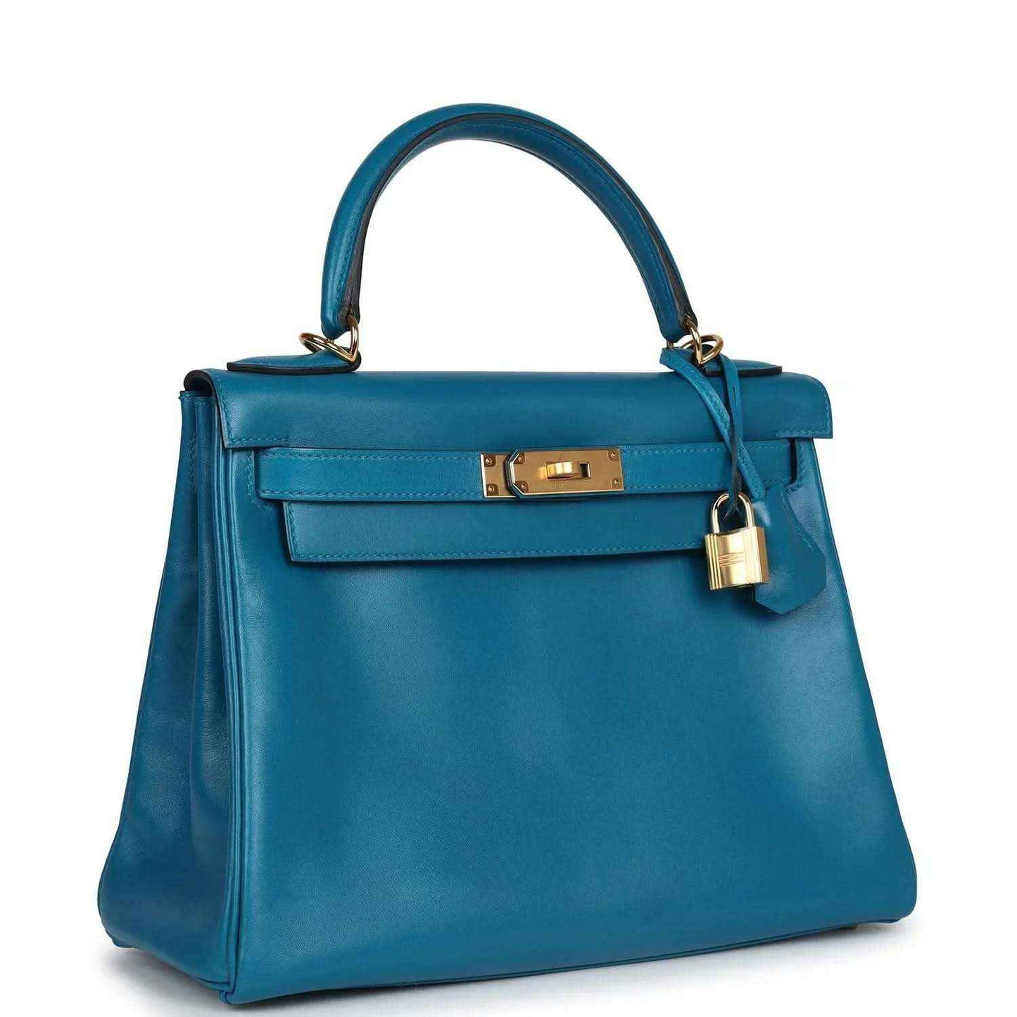 Hermes Kelly Retourne 28 bag in blue leather with front flap, gold lock, and top handles