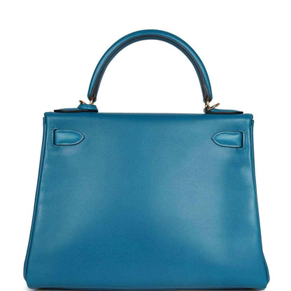 Hermes Kelly Retourne 28 bag in blue leather with back panel and two pull-tab tabs