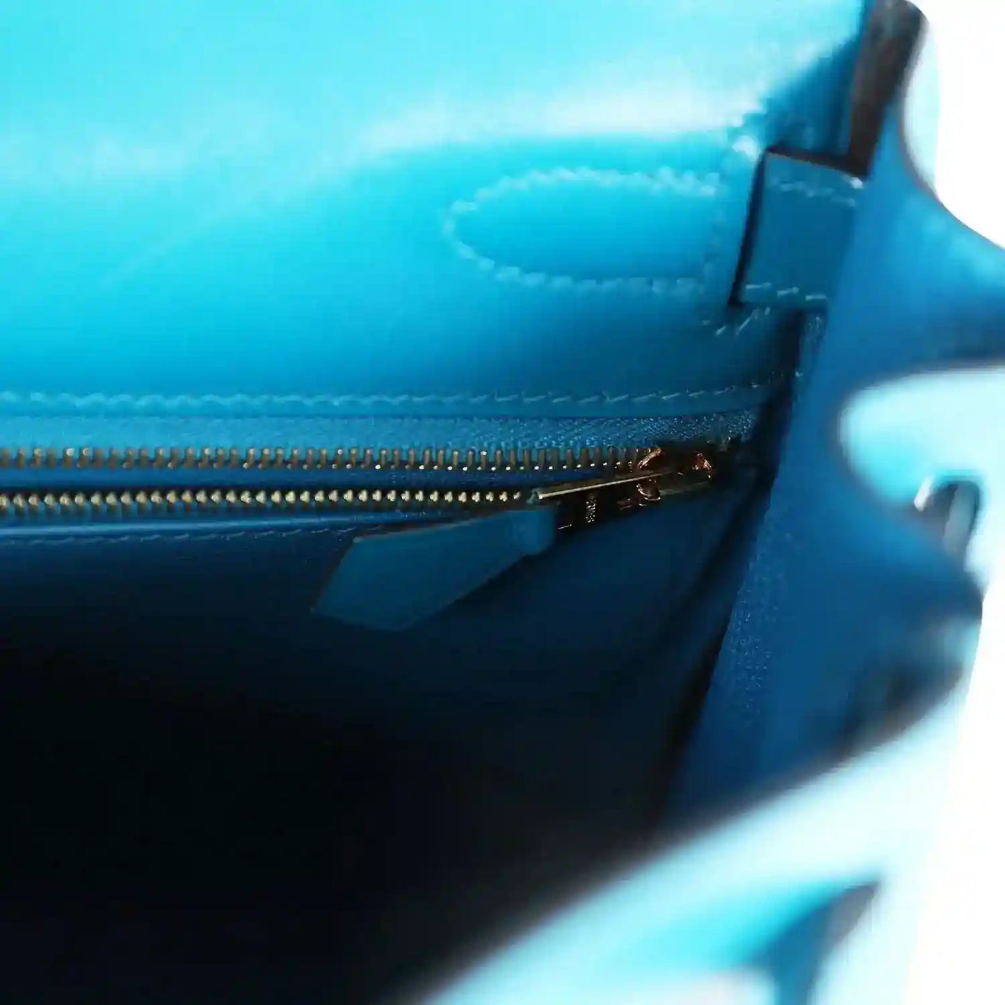 Hermes Kelly Retourne bag interior with blue zipper and stitched trim detail