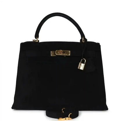 Black suede top-handle handbag with gold front clasp and hanging padlock