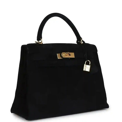 Black suede top-handle handbag with gold front plaque and padlock charm