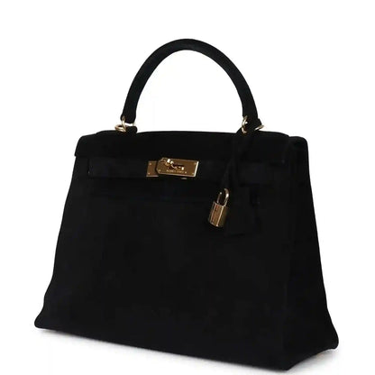 Black suede top-handle handbag with gold front plaque and padlock on side