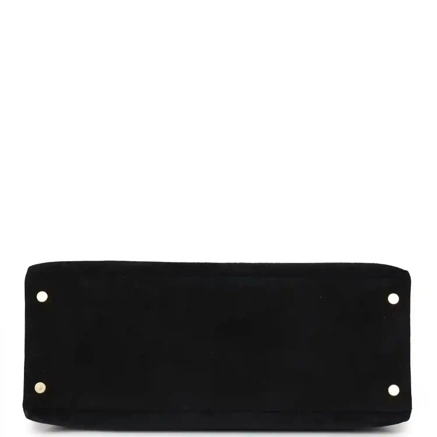 Black suede handbag with four corner studs and centered front panel