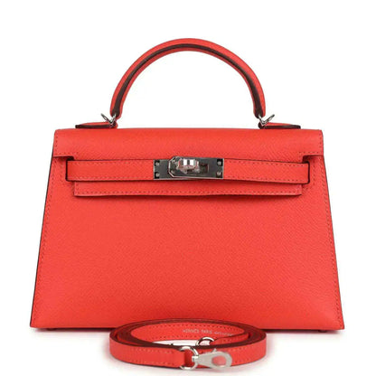 Hermes Kelly Sellier 20 orange-red bag with top handle, front flap and metal clasp