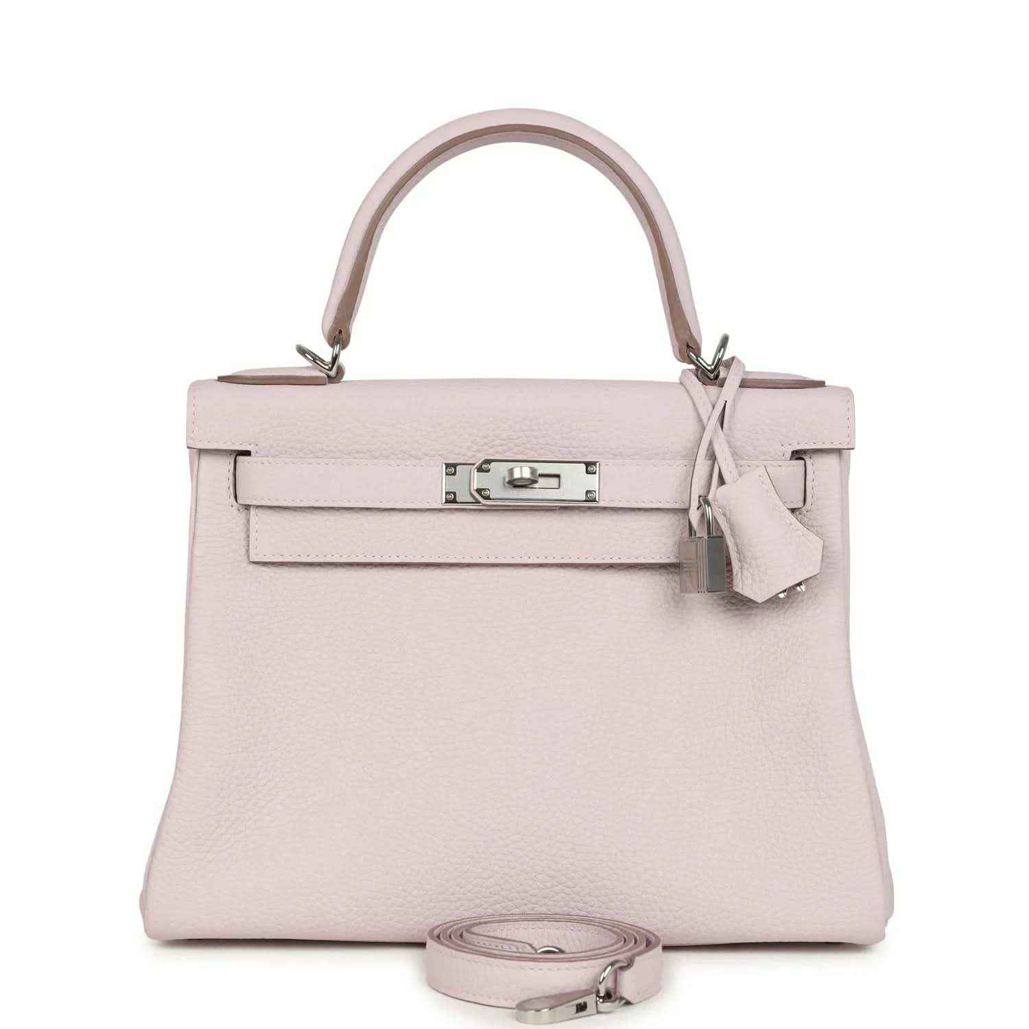 Light mauve leather handbag with top handle, front flap, and silver-tone clasp hardware